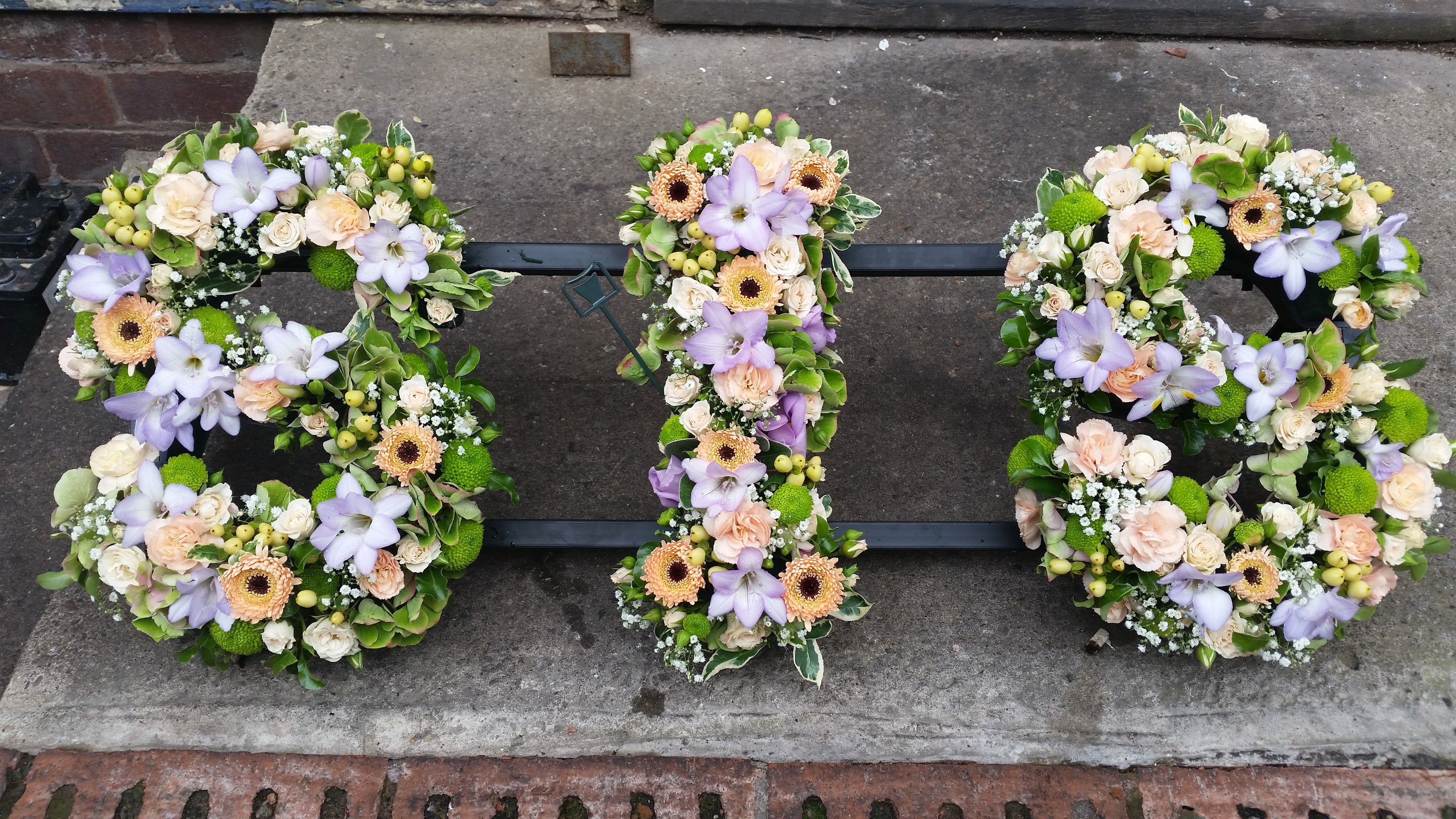 Funeral tribute letters in mixed pastel colours